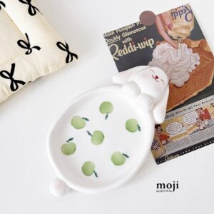 White rabbit dish with green apples